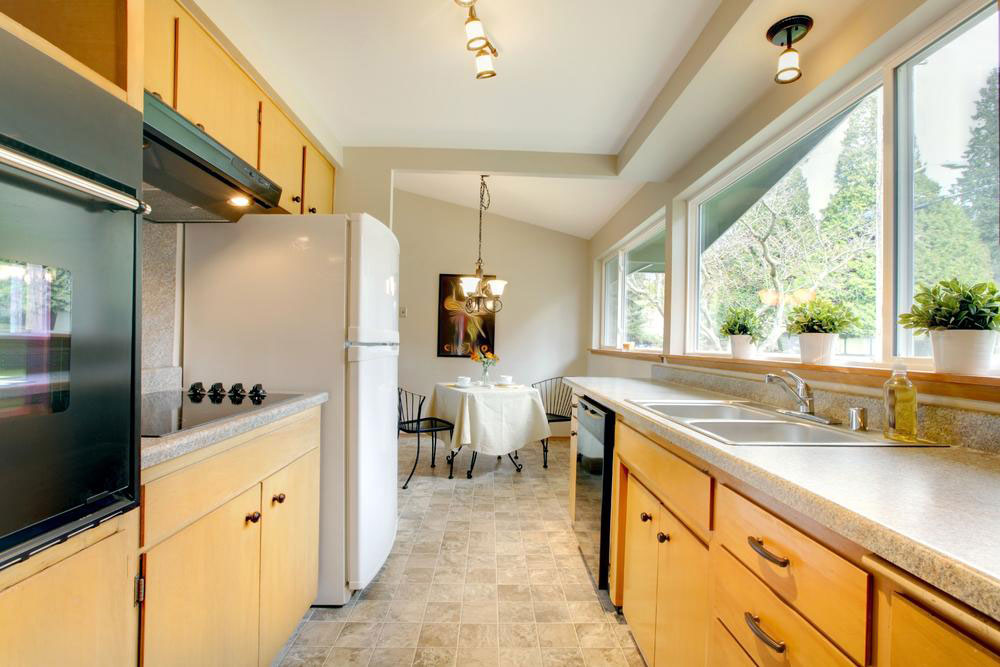 Installing assembled kitchen cabinets saves money and space