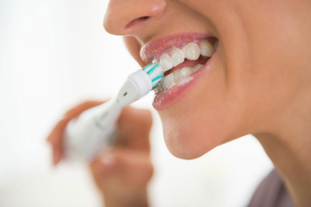 Teeth cleaning guide with Oral B electric toothbrush